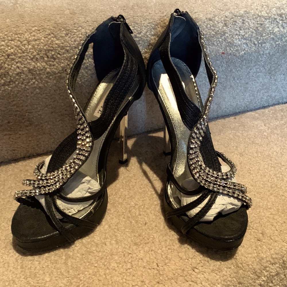 Stunning black Celeste stilletto silver heels covered in rhinestones. Size 7.